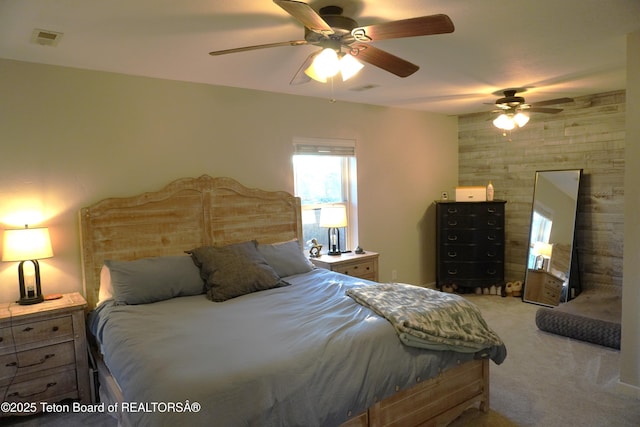 418 Par Ave, Pinedale, WY 82941 - bedroom featuring light colored carpet, a ceiling fan, and wood walls