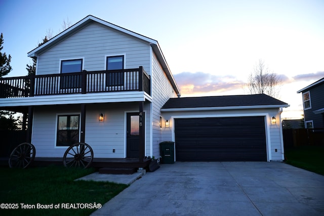 418 Par Ave, Pinedale, WY 82941 - view of front of property with a balcony, a garage, and driveway