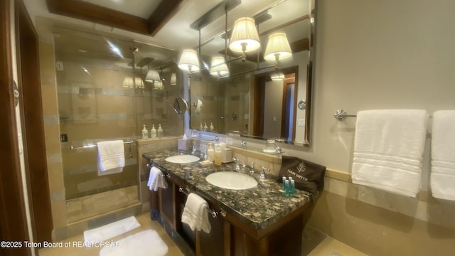 7680 Granite Loop Rd Unit 655, Teton Village, WY 83025 - bathroom with a shower stall and double vanity