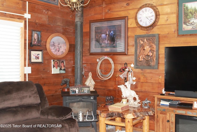 588 S Oak St, Labarge, WY 83123 - living room with a wood stove and wood walls