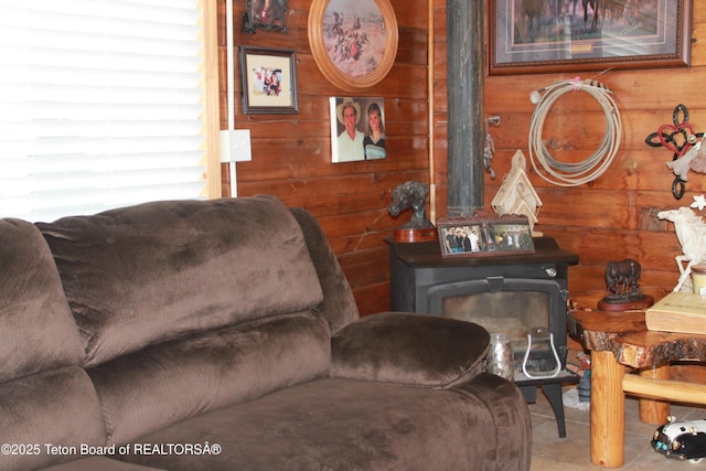 588 S Oak St, Labarge, WY 83123 - sitting room featuring wood walls and a wood stove
