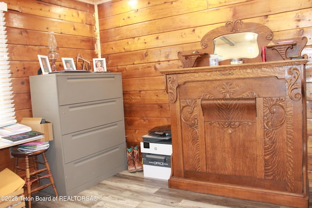 588 S Oak St, Labarge, WY 83123 - bedroom with wood walls and light wood-style floors