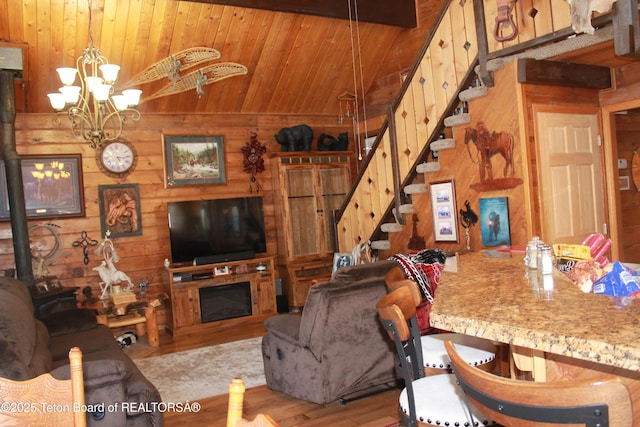 588 S Oak St, Labarge, WY 83123 - living room featuring wood walls, wood ceiling, stairs, wood finished floors, and a chandelier
