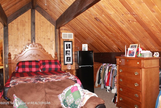 588 S Oak St, Labarge, WY 83123 - carpeted bedroom with freestanding refrigerator, wood ceiling, and wooden walls