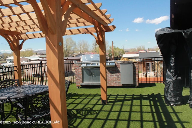 588 S Oak St, Labarge, WY 83123 - view of patio / terrace with an outdoor kitchen and a pergola