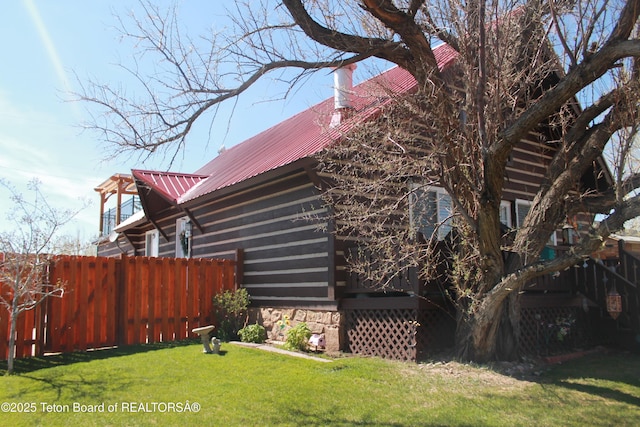588 S Oak St, Labarge, WY 83123 - view of side of home featuring metal roof and a chimney