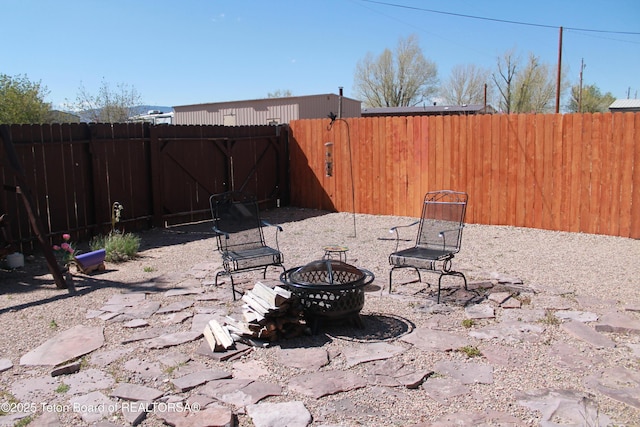 588 S Oak St, Labarge, WY 83123 - fenced backyard with a fire pit