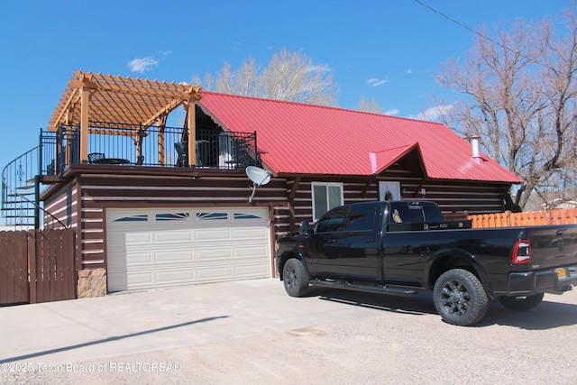 588 S Oak St, Labarge, WY 83123 - log-style house with log siding, metal roof, driveway, and stairway