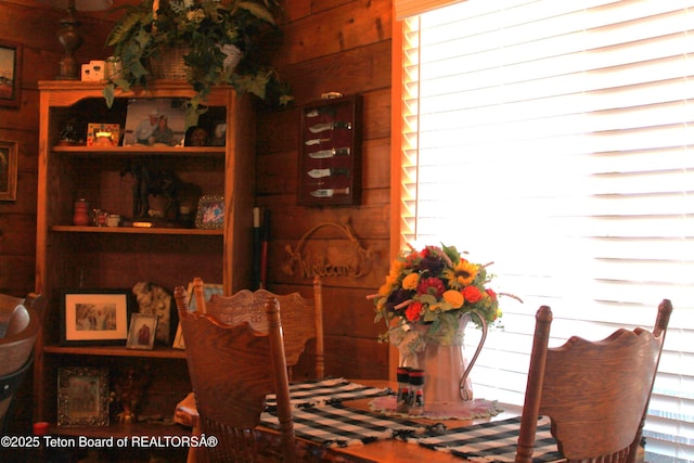 588 S Oak St, Labarge, WY 83123 - dining space with healthy amount of natural light and wooden walls