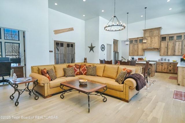 358 Solitude Ln, Tetonia, ID 83452 - living room with a towering ceiling, light wood finished floors, recessed lighting, and a chandelier