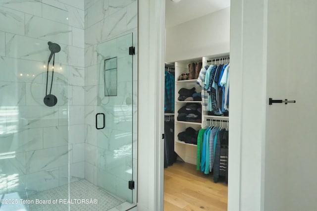 358 Solitude Ln, Tetonia, ID 83452 - bathroom with wood finished floors, a shower stall, and a spacious closet
