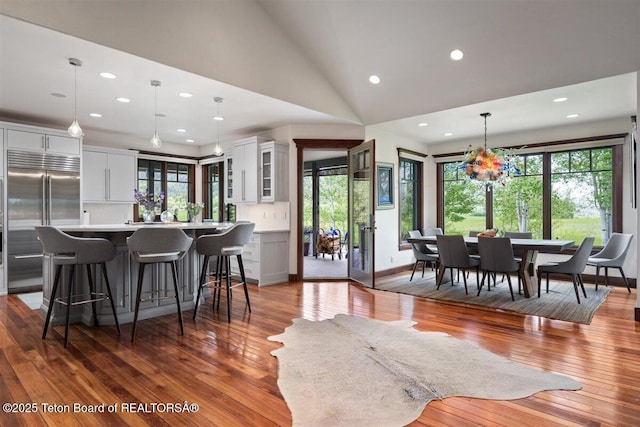 62 Hastings Dr, Victor, ID 83455 - living area with hardwood / wood-style floors, recessed lighting, plenty of natural light, and vaulted ceiling
