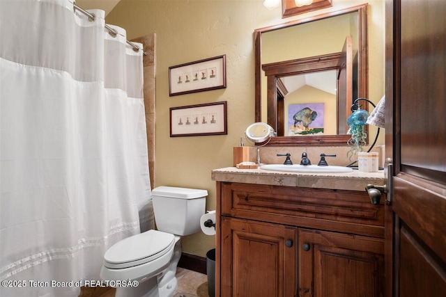 62 Hastings Dr, Victor, ID 83455 - bathroom with vanity, toilet, and a shower with shower curtain