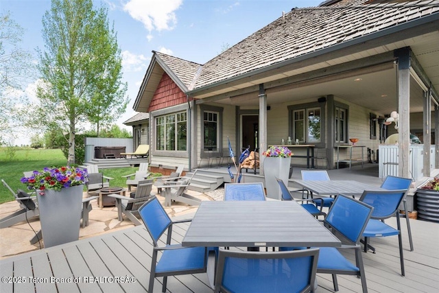 62 Hastings Dr, Victor, ID 83455 - wooden terrace featuring outdoor dining area and an outdoor fire pit