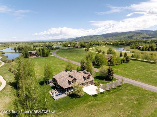 62 Hastings Dr, Victor, ID 83455 - aerial view of property and surrounding area featuring a water and mountain view
