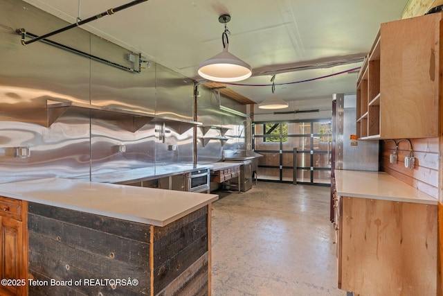 6827 S 1750 W, Victor, ID 83455 - kitchen with finished concrete flooring, open shelves, light countertops, and decorative backsplash