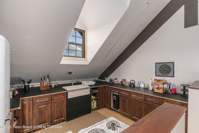 6827 S 1750 W, Victor, ID 83455 - kitchen with vaulted ceiling, a sink, dark countertops, and a skylight