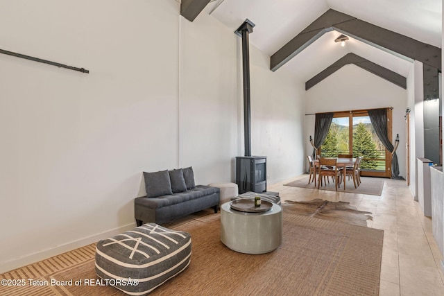6827 S 1750 W, Victor, ID 83455 - sitting room featuring a wood stove, high vaulted ceiling, and beamed ceiling