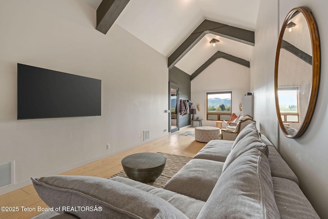 6827 S 1750 W, Victor, ID 83455 - living room with beamed ceiling, high vaulted ceiling, and wood finished floors