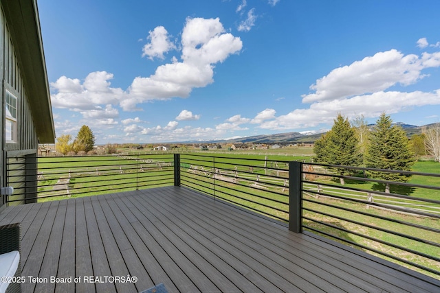6827 S 1750 W, Victor, ID 83455 - wooden terrace with a view of countryside, a yard, and a mountain view