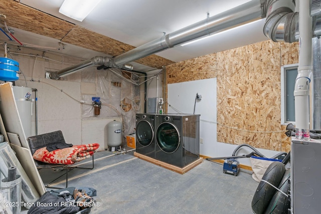6827 S 1750 W, Victor, ID 83455 - unfinished basement featuring separate washer and dryer, a water pressure tank, and water heater