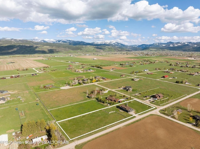 6827 S 1750 W, Victor, ID 83455 - aerial view of sparsely populated area with property boundaries highlighted and a mountain backdrop