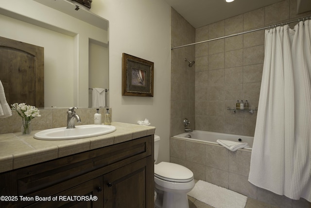 88 Blackfoot Trl, Victor, ID 83455 - bathroom featuring tiled shower / bath, vanity, toilet, and tile patterned flooring