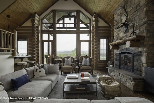88 Blackfoot Trl, Victor, ID 83455 - living room with wood finished floors, high vaulted ceiling, a stone fireplace, and wooden ceiling