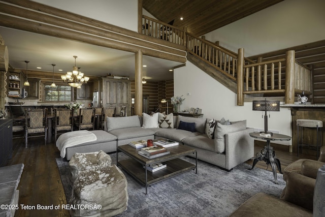 88 Blackfoot Trl, Victor, ID 83455 - living room with dark wood-type flooring, a chandelier, high vaulted ceiling, recessed lighting, and stairs