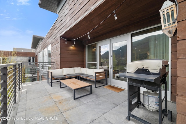 150 W Simpson Ave Unit 405, Jackson, WY 83011 - view of patio featuring french doors, a grill, a balcony, and an outdoor living space