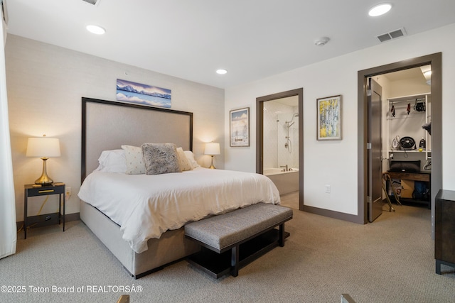 150 W Simpson Ave Unit 405, Jackson, WY 83011 - bedroom with a walk in closet, light carpet, baseboards, ensuite bath, and recessed lighting