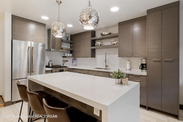 150 W Simpson Ave Unit 405, Jackson, WY 83011 - kitchen featuring open shelves, high quality fridge, a sink, light countertops, and modern cabinets