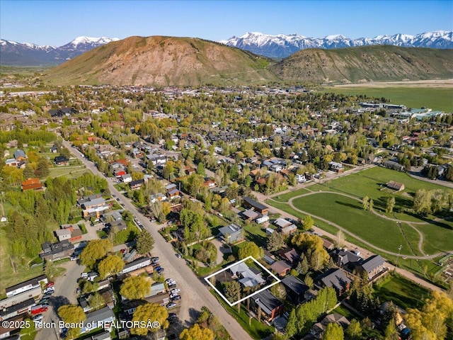 755 Cache Creek Dr, Jackson, WY 83001 - view of property location featuring property boundaries highlighted, a mountain backdrop, and nearby suburban area