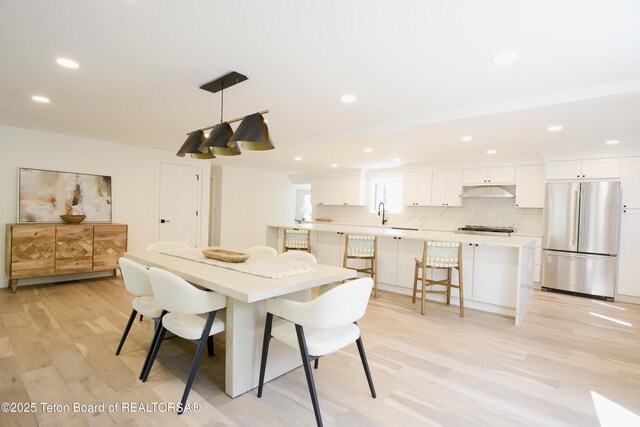 755 Cache Creek Dr, Jackson, WY 83001 - dining area with light wood-style flooring and recessed lighting