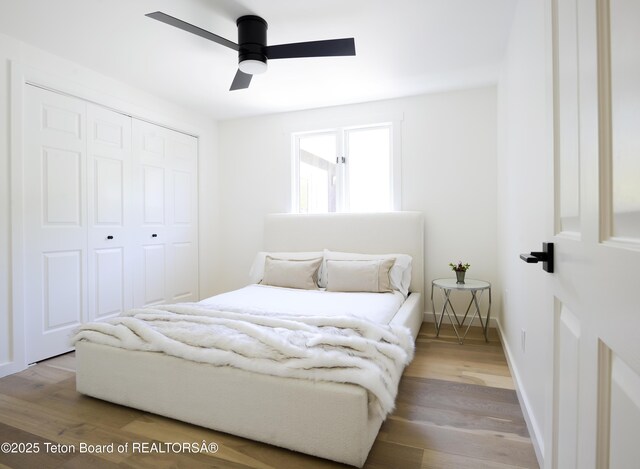 755 Cache Creek Dr, Jackson, WY 83001 - bedroom featuring a closet, wood finished floors, a ceiling fan, and baseboards