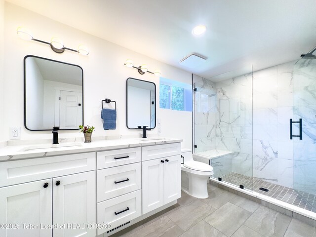 755 Cache Creek Dr, Jackson, WY 83001 - bathroom with a marble finish shower, double vanity, and toilet