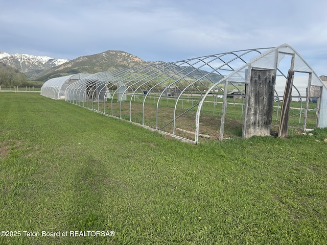 522 El Clark Ln, Smoot, WY 83126 - view of greenhouse featuring a lawn and a mountain view