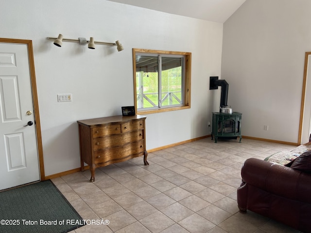 522 El Clark Ln, Smoot, WY 83126 - living area with a wood stove and light tile patterned floors