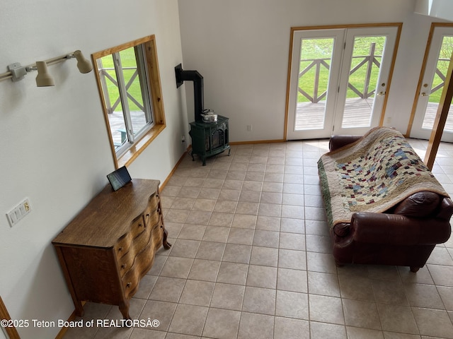 522 El Clark Ln, Smoot, WY 83126 - living area with light tile patterned floors and a wood stove