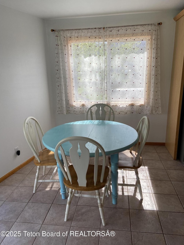 522 El Clark Ln, Smoot, WY 83126 - dining space featuring tile patterned flooring and baseboards