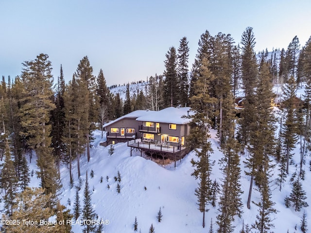6960 Lupine Trl, Wilson, WY 83001 - snowy aerial view featuring a forest view