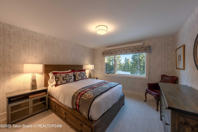 6960 Lupine Trl, Wilson, WY 83001 - bedroom featuring light carpet, wallpapered walls, and baseboards