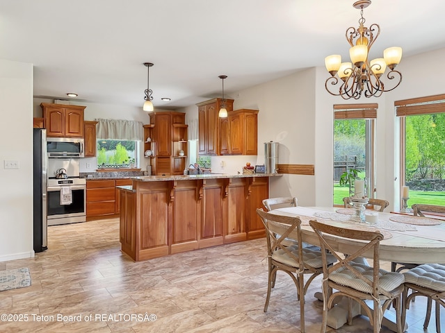33 Wagon Rut Ln, Auburn, WY 83111 - dining room with plenty of natural light, a chandelier, and recessed lighting