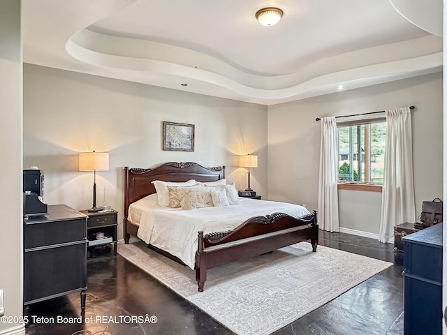 33 Wagon Rut Ln, Auburn, WY 83111 - bedroom with a raised ceiling, finished concrete floors, and baseboards
