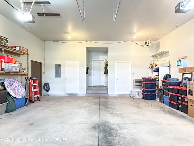 33 Wagon Rut Ln, Auburn, WY 83111 - garage featuring electric panel and a garage door opener