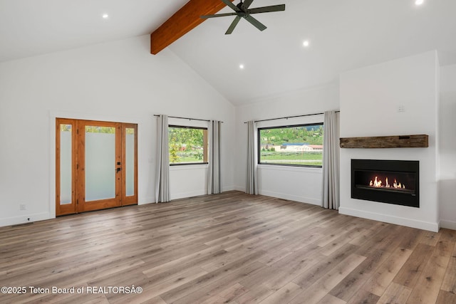 185 Columbine St, Alpine, WY 83128 - unfurnished living room featuring beamed ceiling, high vaulted ceiling, ceiling fan, recessed lighting, and a glass covered fireplace