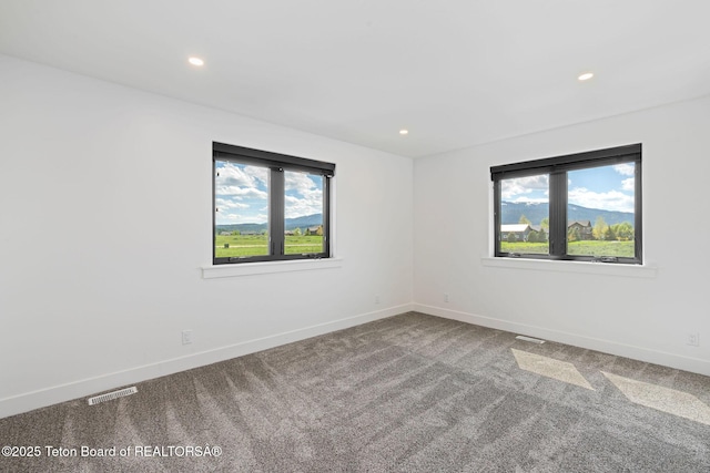 185 Columbine St, Alpine, WY 83128 - spare room with healthy amount of natural light, carpet, baseboards, and recessed lighting