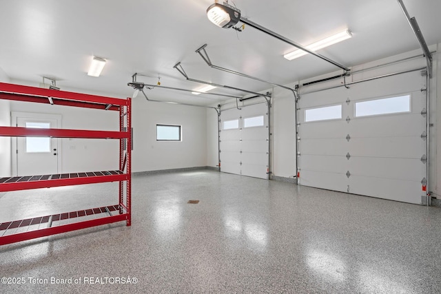 185 Columbine St, Alpine, WY 83128 - garage with a garage door opener and baseboards