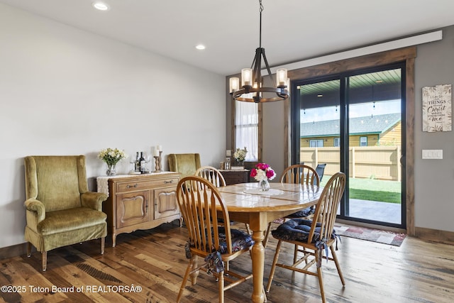 444 Riverview Dr, Alpine, WY 83128 - dining space featuring a chandelier, dark wood-type flooring, baseboards, and recessed lighting