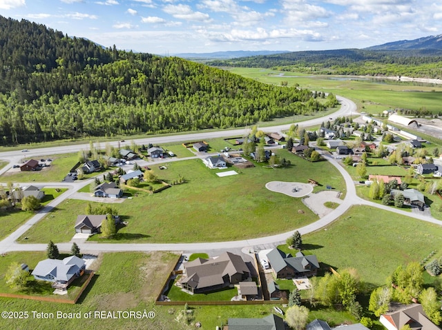 444 Riverview Dr, Alpine, WY 83128 - aerial perspective of suburban area featuring a forest and mountains